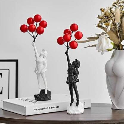 sculpture deux fillette noir blanc vase fleur