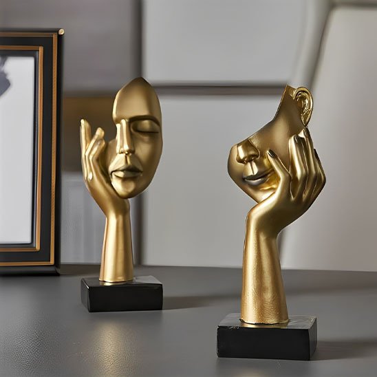 sculpture deux oeil bouche main sur joue