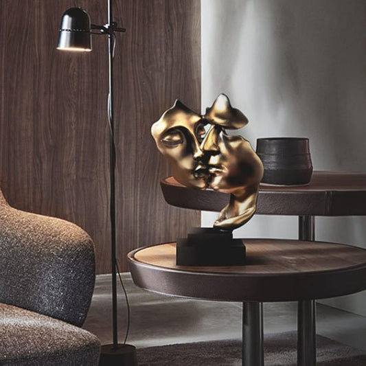 sculpture deux visage or sur table basse