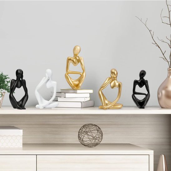 sculpture forme humain or noir blanc